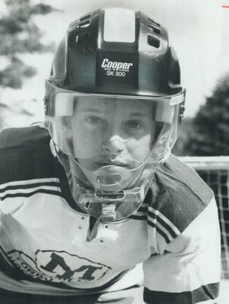 David Granovsky, 13, a keen hockey junior, shows special helmet that gives full facial protection