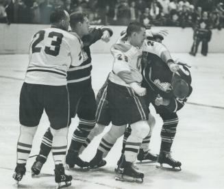 Eddie Shack is centre of Montreal attention, Roberts and Ferguson show him how they feel