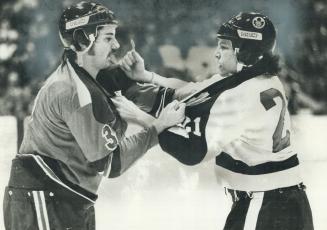 Shall we dance? Paul Heaver (3) of Oshawa Generals and Dave Norris (21) of Marlboros square off for waltz during last night's junior hockey action at (...)