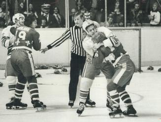 Main event? Toronto Toros' Jim Dorey and Gordie Gallant ( 16), one of Quebec Nordiques' tough guys, wrestle during last night's 4-3 overtime win for Q(...)
