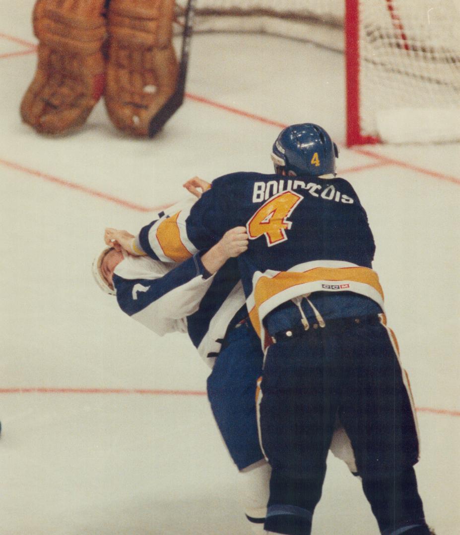 Stretching a point: St. Louis strongman Charlie Bourgeois sees how far Greg Terrion's head will stretch back during second-period battle last night. B(...)