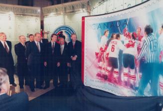 Commemoration: Paul Henderson, left, Yvan Cournoyer and Jean Chretien unveil stamp honouring '72 series at Hockey Hall of Fame yesterday