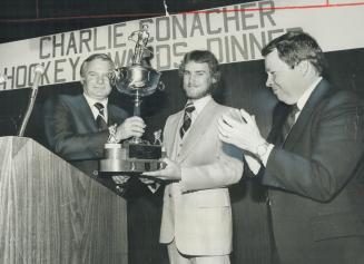 Bill Davis presents Ed Staniowski with Conacher Trophy as MP David Crombie leads applause