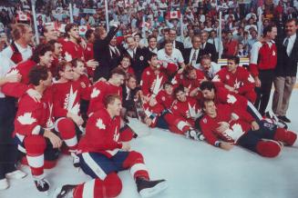 Picture imperfect: Team Canada's players and coaches clown around as they line up for a photo after their Canada Cup Victory