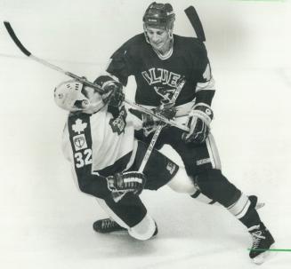 How do you do?: Rugged St. Louis rearguard Charles Bourgeois introduces himself to Steve Thomas of the Leafs last night during Game 4 of their Norris (...)