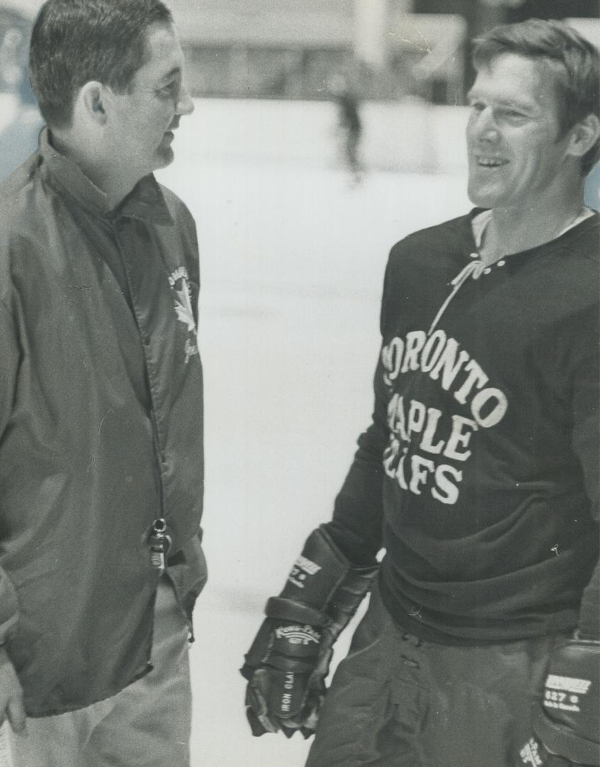 Welcome back, Tim, Johnny McLellan (left), coach of Maple Leafs, welcome all-star defenceman Tim Horton to practice today at Maple Leaf Gardens. It wa(...)