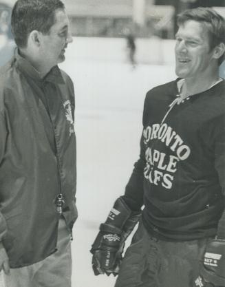 Welcome back, Tim, Johnny McLellan (left), coach of Maple Leafs, welcome all-star defenceman Tim Horton to practice today at Maple Leaf Gardens. It wa(...)