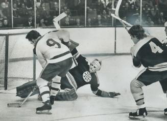 Getting ready to slide puck into net is Maple Leaf centre Norm Ullman, who has Boston Bruins' goalie Gilles Gilbert at his mercy in National Hockey Le(...)