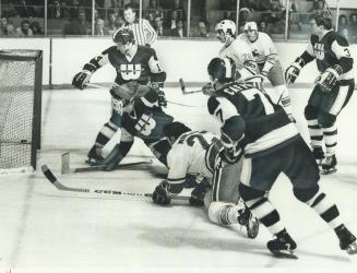 Off To Fine Start: Sprawled on his knees, Frank Mahovlich (27) looks at second of three goals he fired for Toronto Toros in World Hockey Association Opener at the Gardens last night