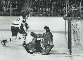 Foiled By A Bouncing Puck, Maple Leaf centre George Ferguson is foiled both by bouncing puck and a lunging Chicago Black Hawk goalie Tony Esposito dur(...)