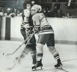 Shall We Dance? Or do you want a look at my face mask? That's what Greg Neeld (6) appears to be asking Edmonton's Dan Spring during last night's game (...)