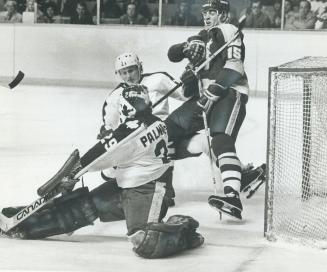 Stars' rookie Bob Smith (15) is a hard man for Leafs' Mike Palmateer and Borje Salming to stop