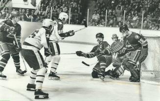 How did it go in? Despite valiant efforts by goaltender Jari Kaarela and winger Lanny McDonald, Colorado Rockies failed to stop shot by Wilf Paiement (...)