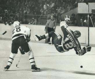 Into the Blue: St. Louis forward Perry Anderson heads for a rough landing after being tripped up by Leaf defenceman Dave Farrish in last night's game (...)