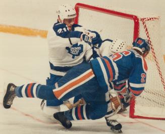 Leafs beat Oilers in overtime, Veteran Maple Leaf defenceman Borje Salming fends off Oiler winger Mike Krushelnyski in front of the Toronto goal durin(...)