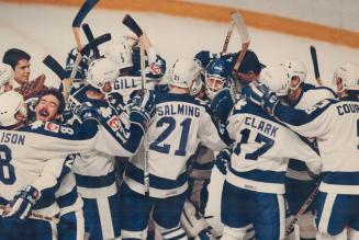 A mob of ecstatic Maple Leafs descends on the hero of the moment, and the series, goalkeeper Ken Wregget, following his clinching shutout of the Blues