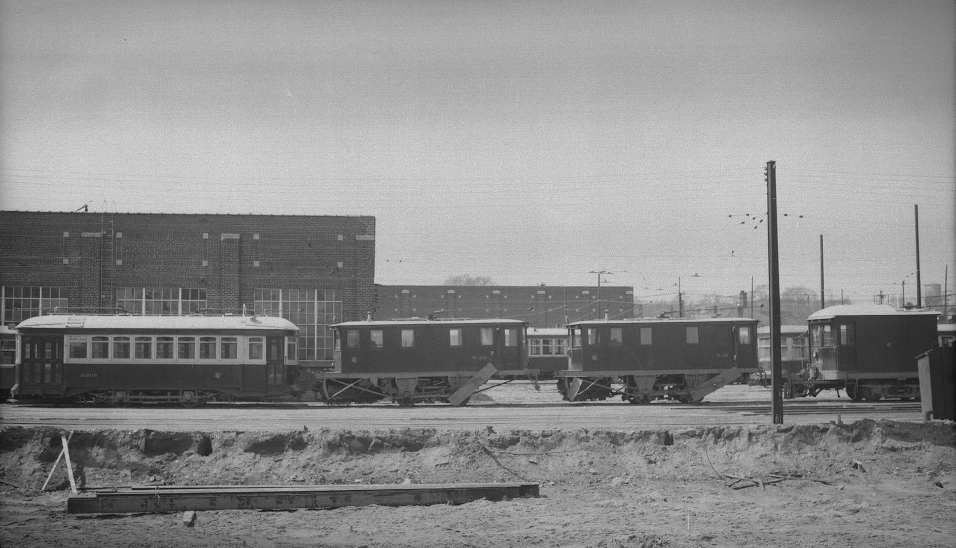 T.T.C., #2208, (scraper car, at left), at Eglinton carhouse, also showing sweepers S-22 (centre) & S-21 (right centre). Toronto, Ontario