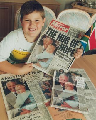 Looking back: Nine-year-old Alon Meyer with press clippings of his famous meeting with South African President Nelson Mandela