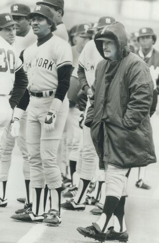 Who's that hooded man? It's obvious that Toronto's chilly April temperatures leave Billy Martin cold