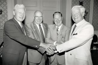 All hail the chief: From left, former Metro police chiefs Harold Adamson and Jack Ackroyd, retiring Chief Jack Marks and his successor William McCormack join hands at a luncheon and roast for Masks