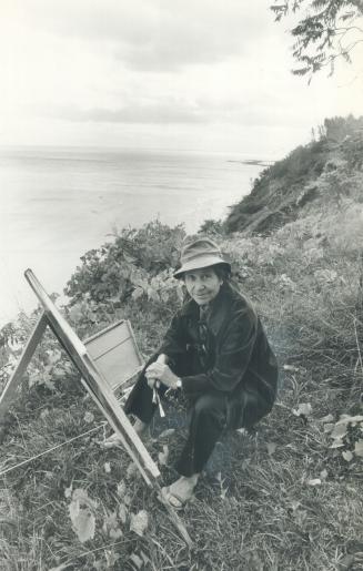 Landscape artist Doris McCarthy sits at her easel on the Scarborough Bluffs