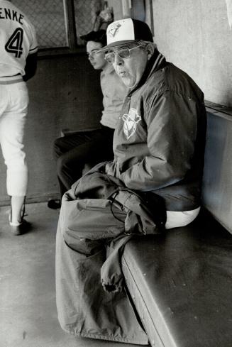 It's cold: Jays' manager Bobby Mattick wears two jackets to keep warm at last night's game against Orioles