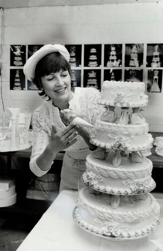 The 25-year-old wedding-cake wizard puts the finishing touches to what she calls the centrepiece of your wedding
