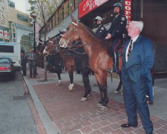 Centre of attention: Metro police chief William McCormack inspects mounted officers at Toronto's Eaton Centre yesterday evening