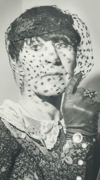 Designer Pat McDonagh with veil that won raves