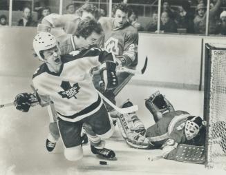 Lanny McDonald's expression tells story as he's flattened by Flames' Miles Zaharko in front of Atlanta geal