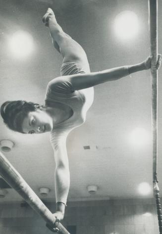 Susan McDonnell, 20, of Toronto shows precision training on bars