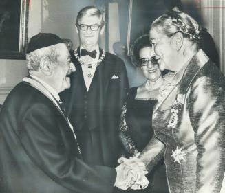 Top honor. Retired rabbi and master of 40 languages, Ernest Klein (left), 79, of Toronto, is congratulated by Lieutenant-Governor Pauline McGibbon aft(...)