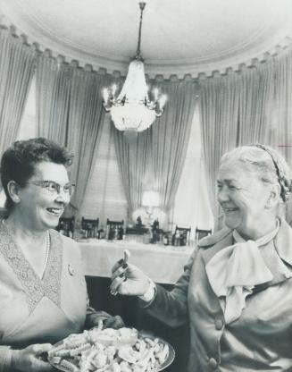 Nutritious Nibble of raw green pepper is served to Lieutenant-Governor Pauline McGibbon by Mrs