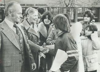 Waiting after school to tell her how much they enjoyed her visit, youngsters at Fisherville Junior High School reach out to shake hands with Lieutenan(...)