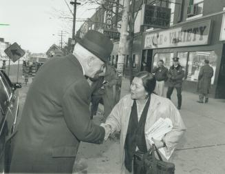 Chief comes calling. Metro police Chief William McCormack greets a woman in the Vietnamese community on Spadina Rd. yesterday. Police have boistered p(...)