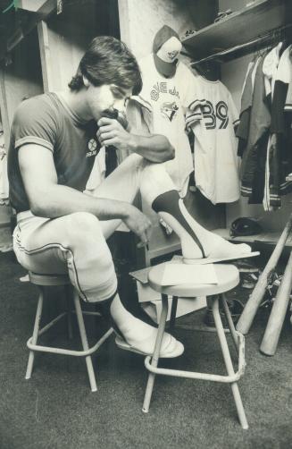 Ballplayer McKay ponders quiz in the Jays' dressing room at Exhibition Park