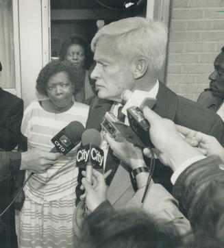 The chief calls: Police Chief William McCormack talks to reporters after visiting the Etobicoke home of Pauline Lewis, left, whose daughter was wounded by a police bullet