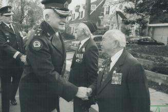 Veterans honored: Metro police Chief William McCormack greets Alexander Spivak, a World War II Russian pilot who took part in a parade yesterday by Jewish War Veterans of Canada