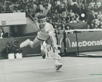 Lunging to victory: John McEnroe won the latest round in his running battle with Bjorn Borg but the issue went to a tiebreaker before the young American defeated the SuperSwede