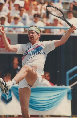 John McEnroe got a leg up on this hot shot from Amos Mansdorf in yesterday's action at the Canadian Open tennis tourney