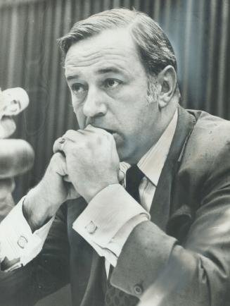 A Pensive Darcy McKeough tells Queen's Park reporters today he soon will be starting meetings in 11 centres across the province to discuss the 1978 mu(...)