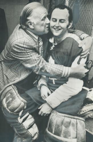 A hug for the leafs' hero. Overjoyed by Leafs' 2-1 victory last night over Los ANgeles Kings, team owner Harold Ballard hugs 27-year-old rookie goalte(...)