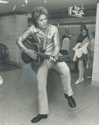 Subway Elvis Mike McTaggart plays a song in Yonge-Bloor subway station, which 16-year-old Grade 11 Etobicoke student says is where the people are