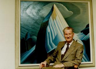 He started it all: Robert McMichael poses with Lawren Harris' classic 1930 canvas, Mount Lefroy, at gallery in Kleinburg that's celebrating its 25th anniversary