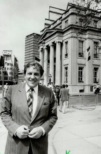 Roy McMurtry smiles broadly in front of his domain, Canada House on Trafalgar Square