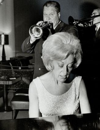 Jimmy and Marian McPartland. Their act slips away in the huge Plaza room