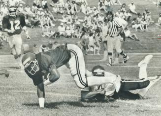 Terry Metcalf (left) feels the wrath of Steve Ackroyd