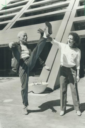 Getting a kick out of fitness. Former governor-general Roland Michener displays his high-stepping ability for Canada's finest woman marathoner, Jacque(...)