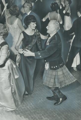 Governor-general in kilt. Clad in Scottish kilt and sporran, Governor-General Roland Michener swings around the floor last night at the St. Andrew's S(...)