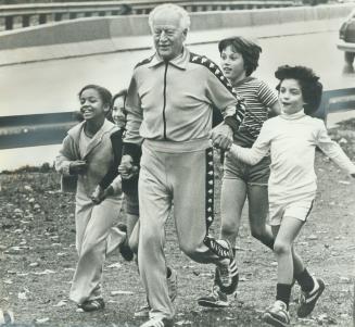 On the run Roland Michener, former governor-general, leads Rosedale Public School children on a two-mile jog during lunch break yesterday. Before the (...)